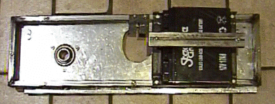 The battery mounted on the axle bracket 
