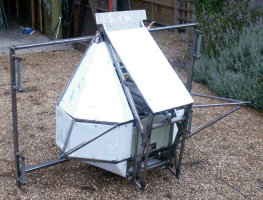 The hog resting on its backside on the new cradle